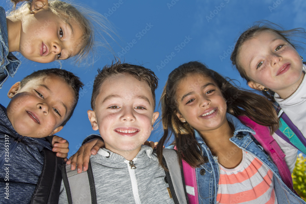 students outside school standing together students outside school standing together