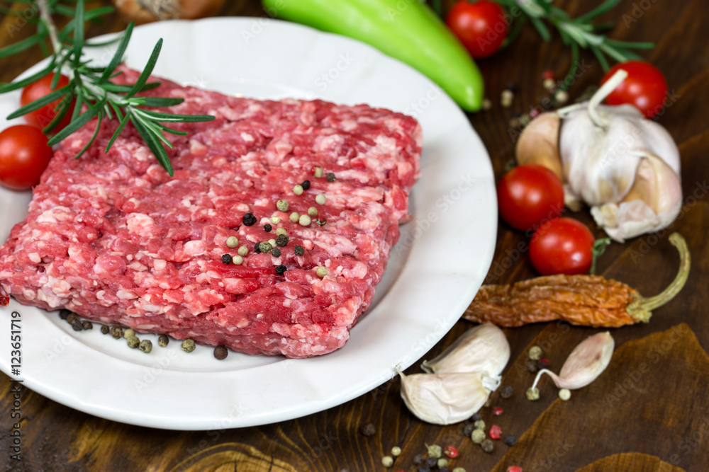 Raw fresh minced meat on plate - ground beef meat
