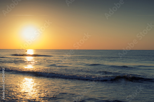 Sunrise on the beach and clouds