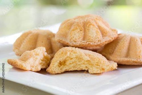 Egg cake, delicious dessert in white dish on tile table in the garden / Adjust blurred and Selective focus for background