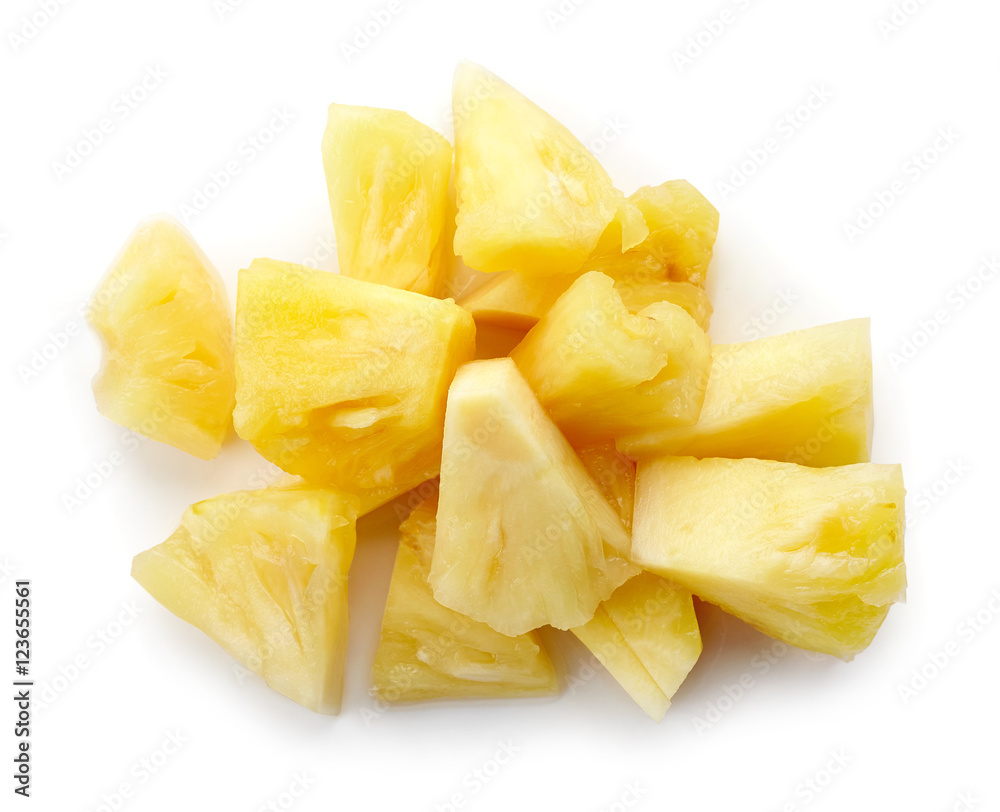 Canned pineapple chunks isolated on white, from above Canned pineapple chunks isolated on white, from above