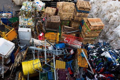The dump with waste iron, wood, plastic, paper