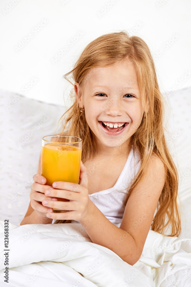 Portrait of happy little girl with glass of juice Portrait of happy little girl with glass of juice