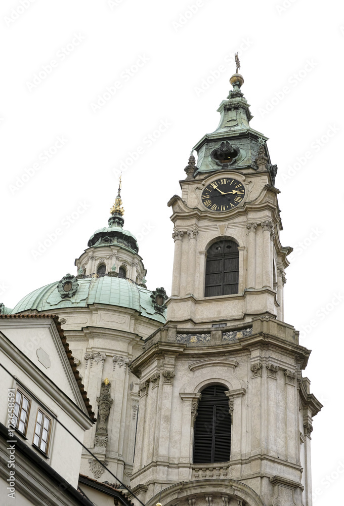 The dome and clock tower of St Nicholas church in the City of Prague, Czech Republic