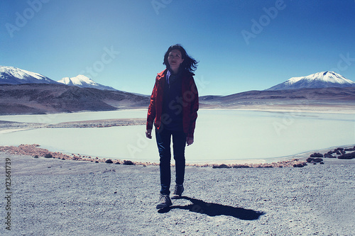 caucasian skinny woman near Lagoon in Andean highlands in Bolivi photo