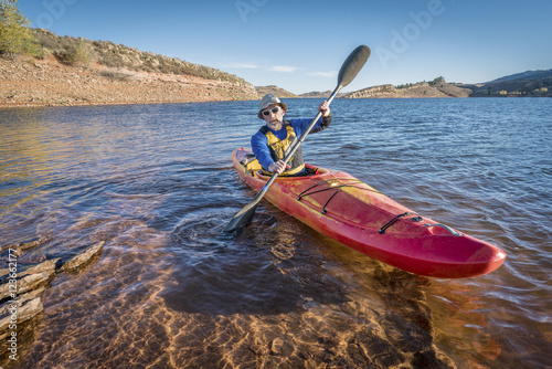 paddling river kayak on lake