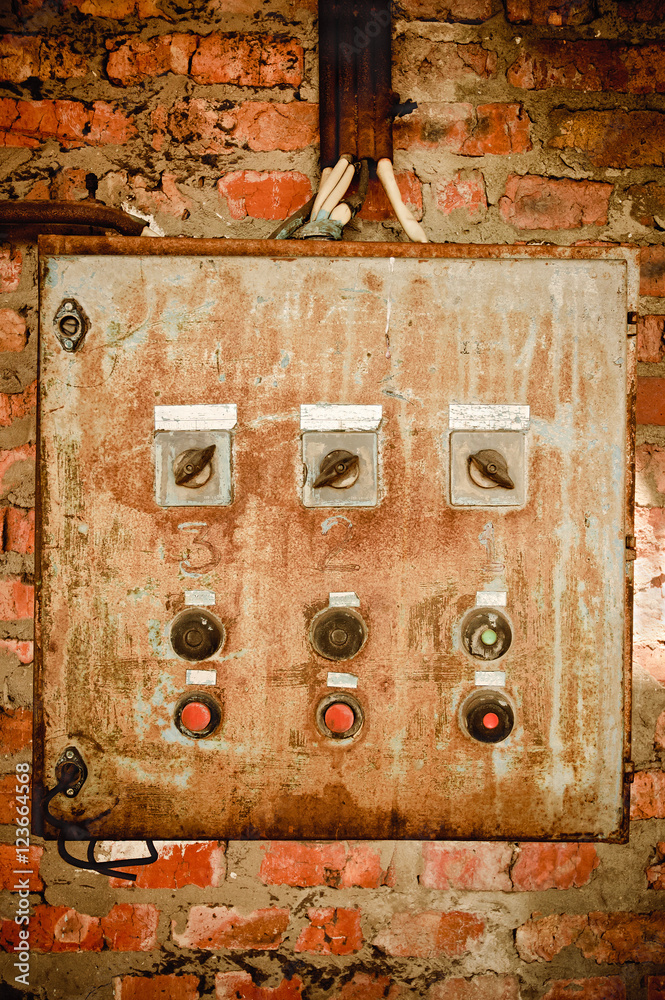 An old rusty control panel on the wall An old rusty control panel on the wall