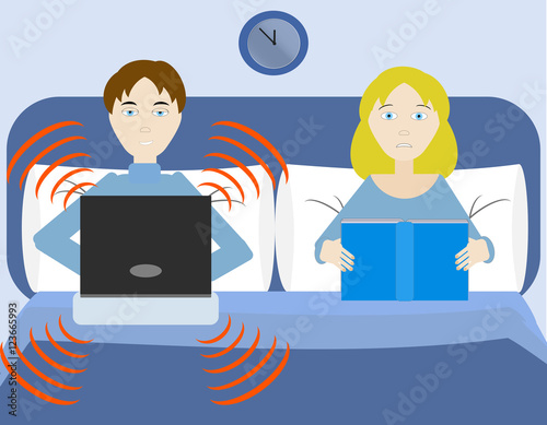 A man plays with his computer at bed disturbing his woman.