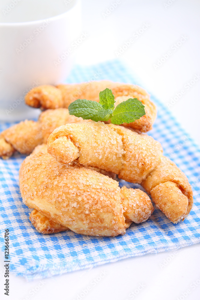 cookies with jam on a white plate on a white background