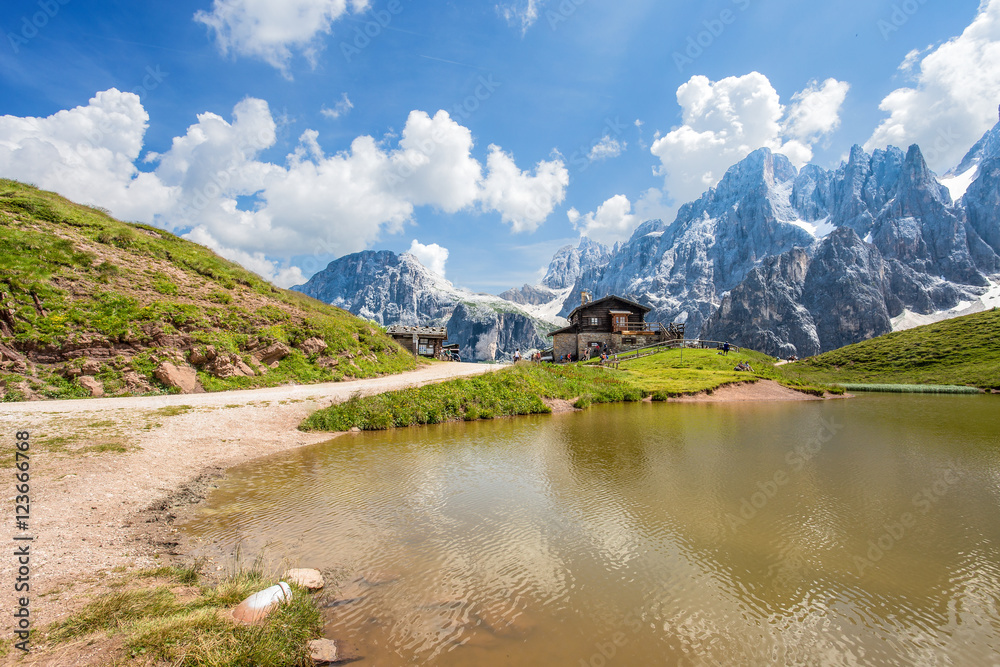 Dolomites Alps in Italy, Pale di San Martino mountains and Baita Segantini with the lake / landscape