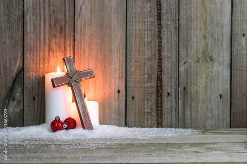 Slika na platnu White candles, wood cross and red holiday ornaments