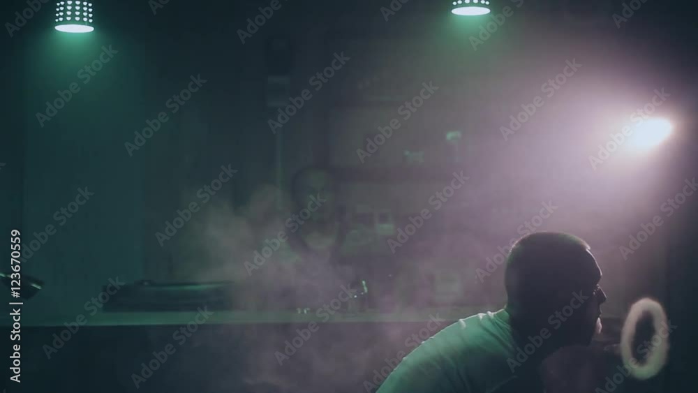 Man vaping in vape shop Man vaping in vape shop