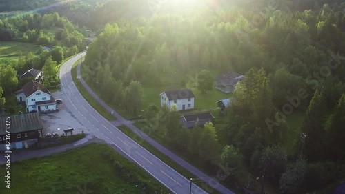 Aerial Shot of Country Road Surrounded by Forest photo