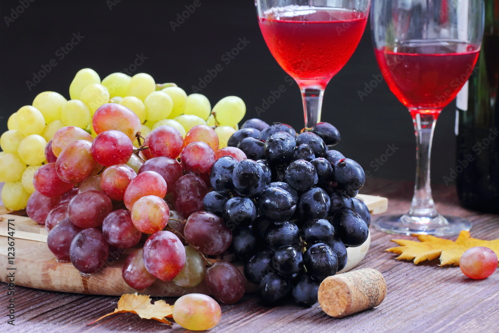 Sweet grape of different kinds and red wine