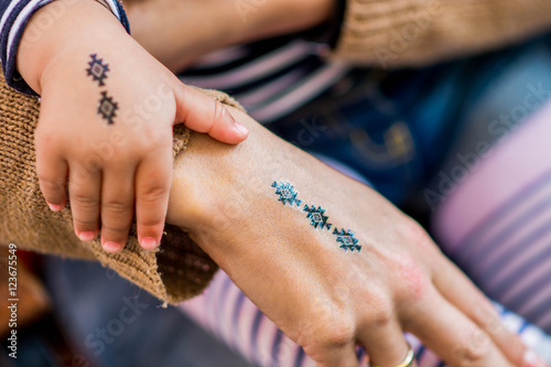 Mother and daughter fake tatoos