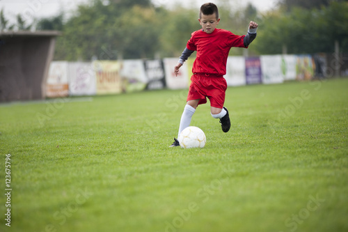 Little soccer player in action © marritch