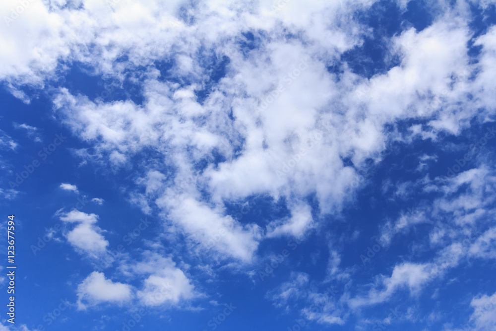 Obraz premium Blue sky background with white clouds. The vast blue sky and clouds sky on sunny day. White fluffy clouds in the blue sky.