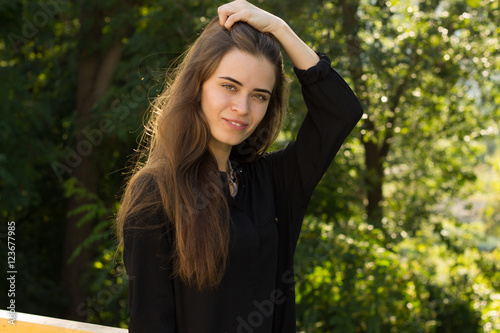 Young woman fixing her hair