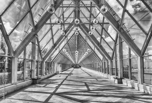 Walking inside Pushkinsky Pedestrian Covered Bridge in central M photo