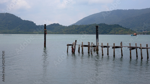Wooden jetty on exotic beach Koh Chang island, Thailand