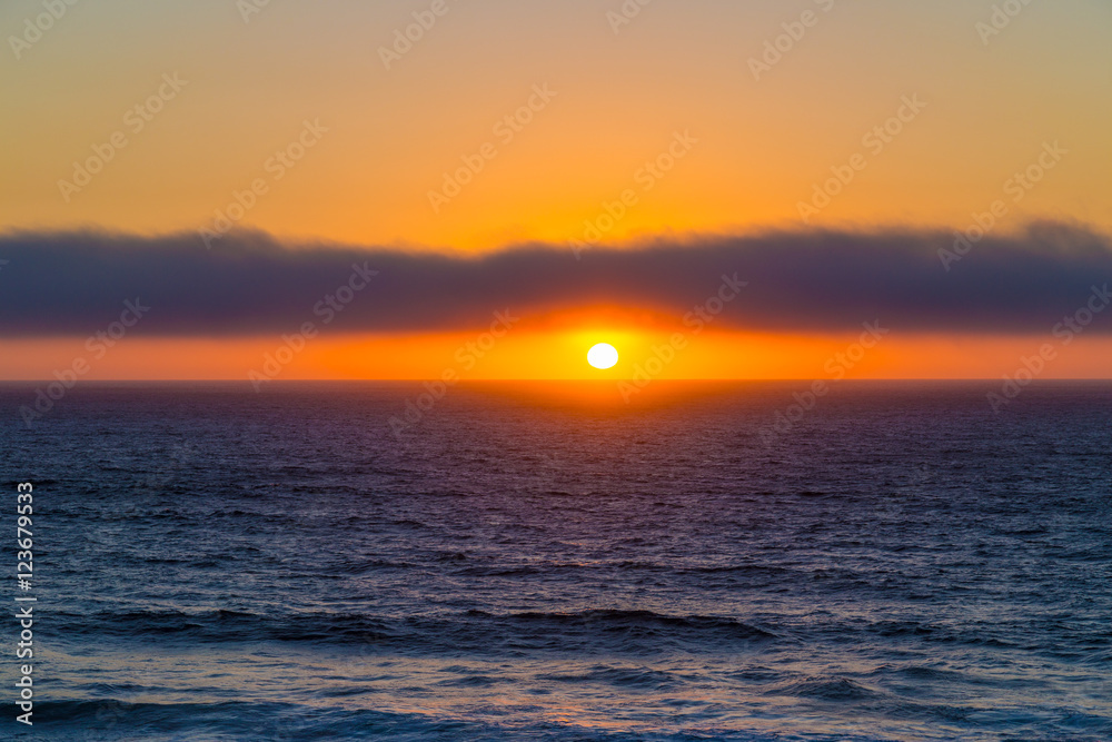 Cloudy sunset over ocean near Cascais, Portugal