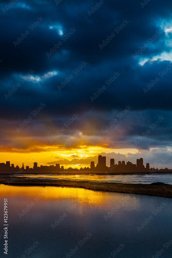 City Skyline  at Sunrise or Sunset with Water in Foreground