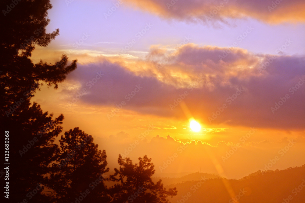 Fototapeta premium Sunset at mountain behind the clouds at lake Neelam