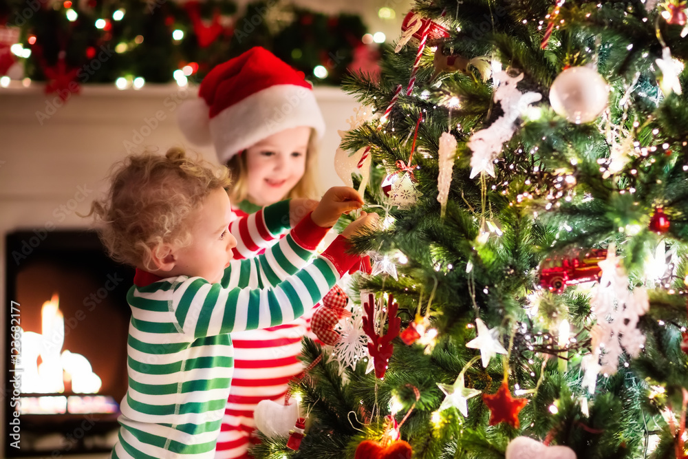Kids decorating Christmas tree