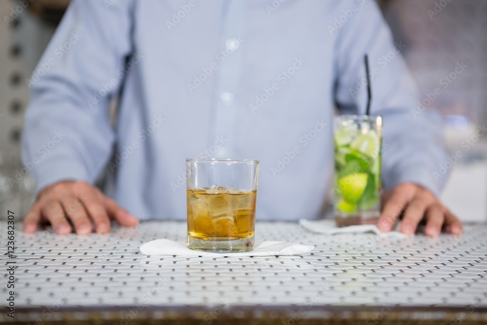 Glass of whisky on bar counter Glass of whisky on bar counter
