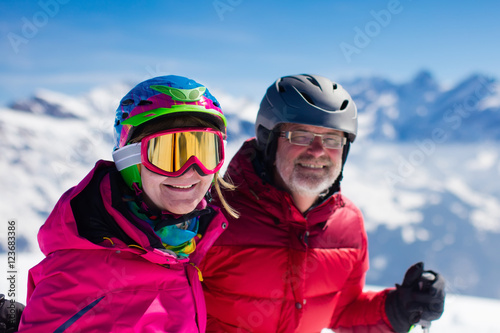 Mature couple skiing in the mountains © famveldman