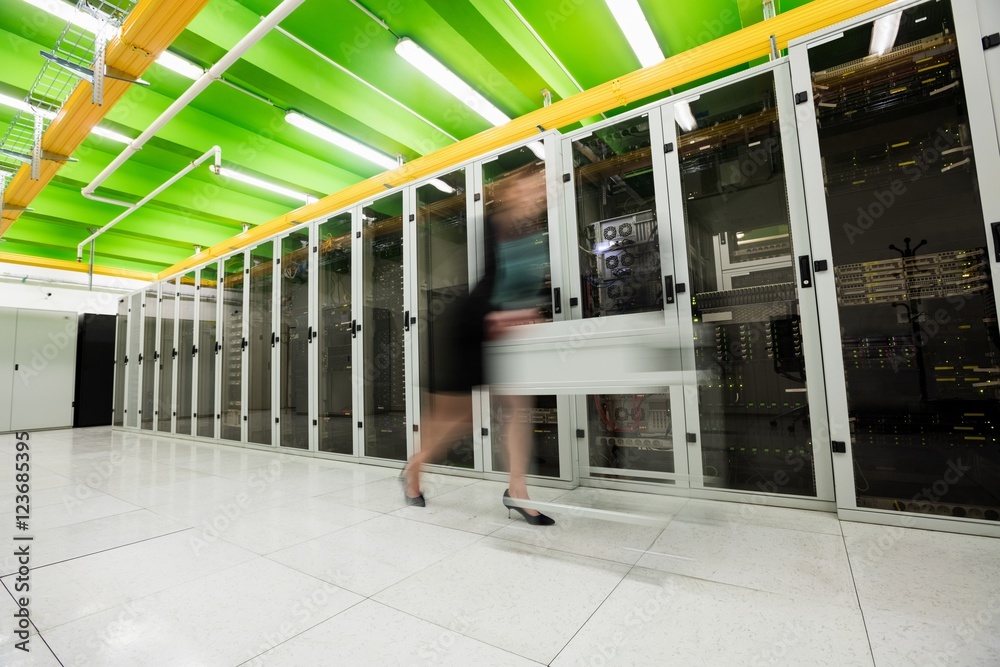 Fototapeta premium Technician pushing cart on hallway