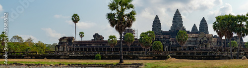 Panoramic view of ancient ruins of temple complex Angkor Wat seen across the pond with lilies, Siem Reap, Cambodia.