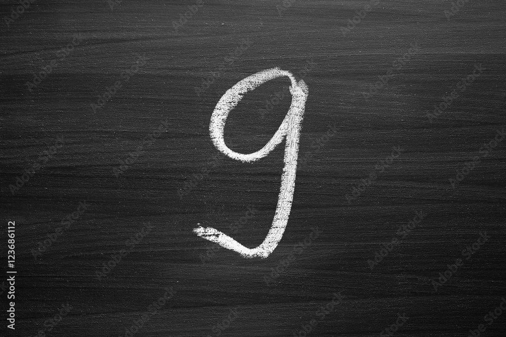 number nine enumeration written with a chalk on the blackboard number nine enumeration written with a chalk on the blackboard