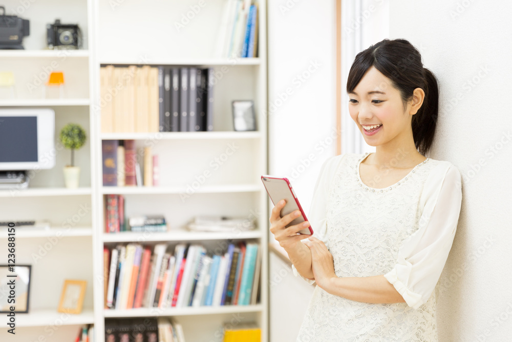 attractive asian woman using smart phone attractive asian woman using smart phone