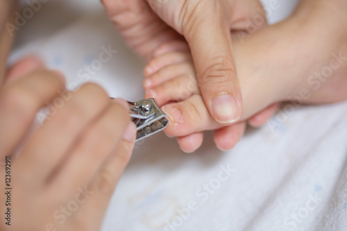 cutting baby nails © patcharaporn1984