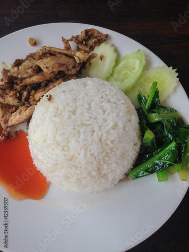 Fried chicken with black pepper and rice,vegetable,tomato sauce,name in thai