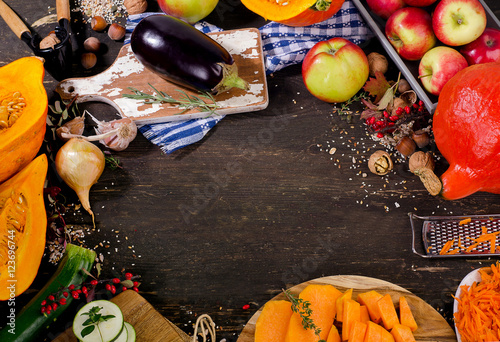 Autumn vegetables and fruits on wooden board.