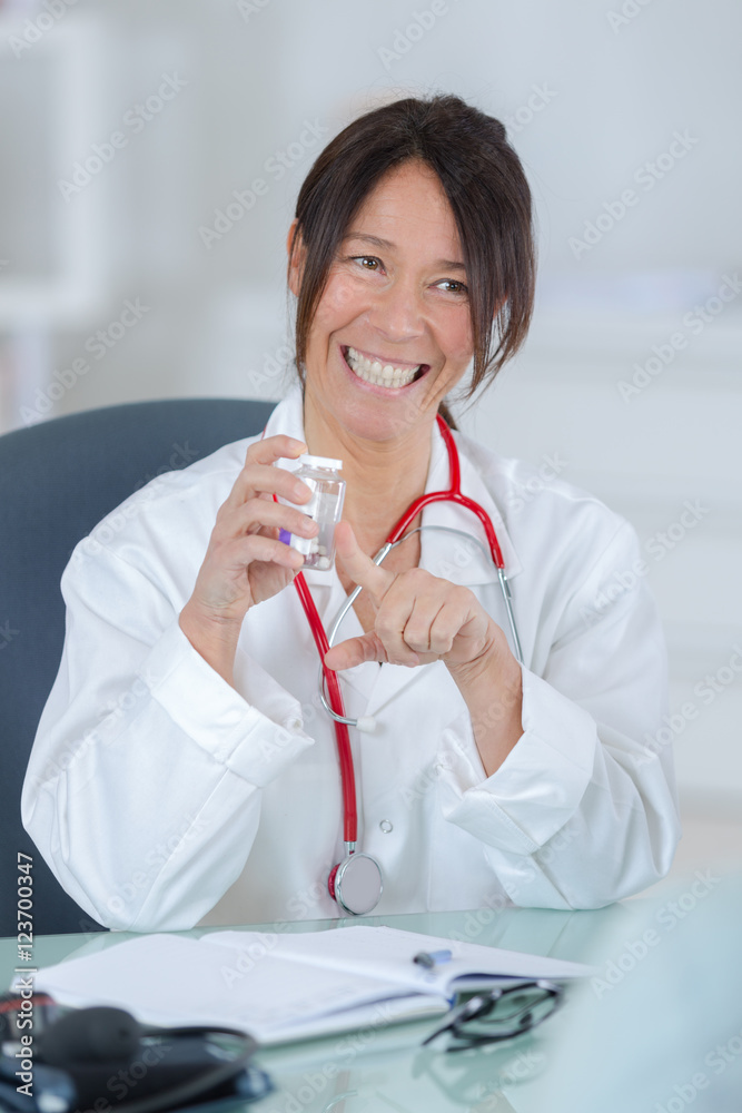 pretty female doctor showing pills to patient pretty female doctor showing pills to patient