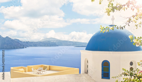 view of orthodox church and house terrace at sea
