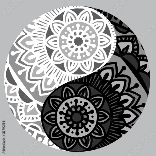 Drawing of a black and white mandala  round ethnic ornament  in shape of symbol yin yang