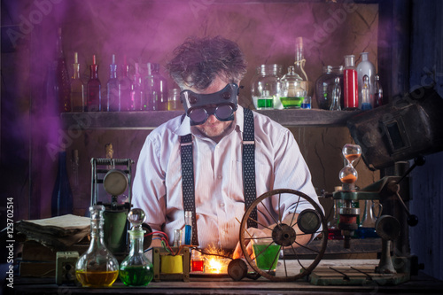 crazy medieval scientist working in his laboratory