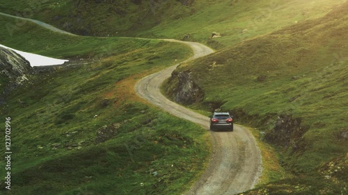 Aerial Shot of Car Moving on Curvy Mountain Road in Norway.