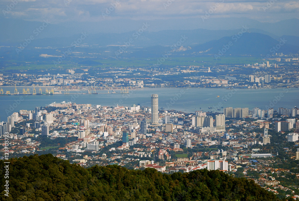 Bird Eye view from Penang Hill. The iconic building in Penang,KOMTAR Tower with mainland, sea and Penang Port background
