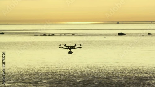 Wallpaper Mural Six Rotor Drone with Camera on Gimbal flying in the Sky. Shot in Slow motion.  Torontodigital.ca