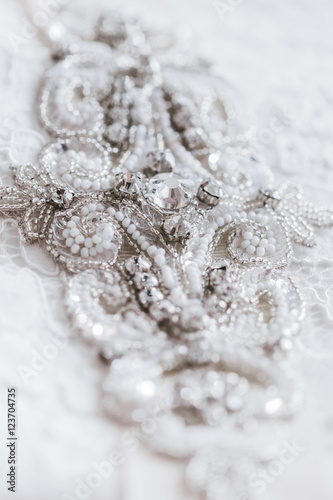 Beautiful details of a wedding dress beadwork close-up