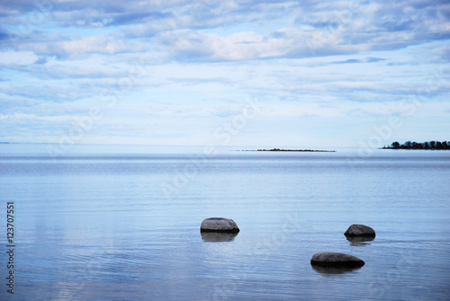 Coastal view with rocks in calm water