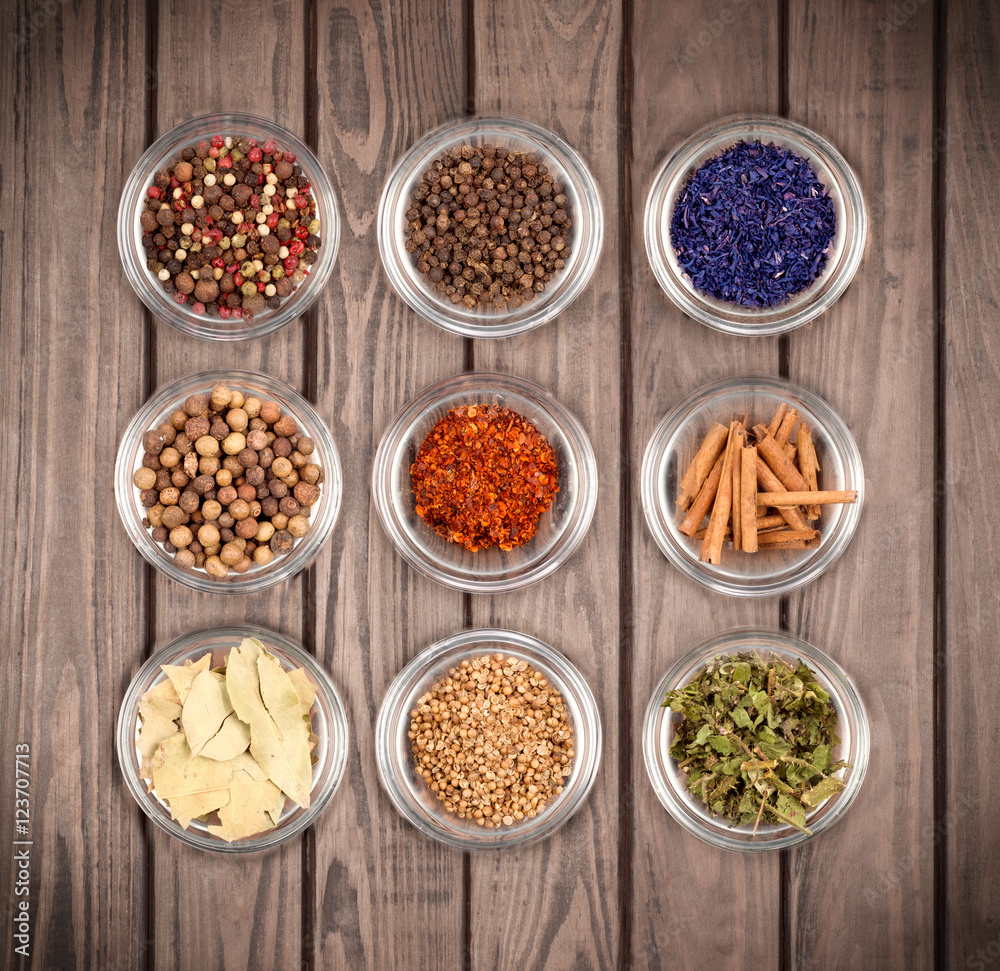 Various spices on a wooden background