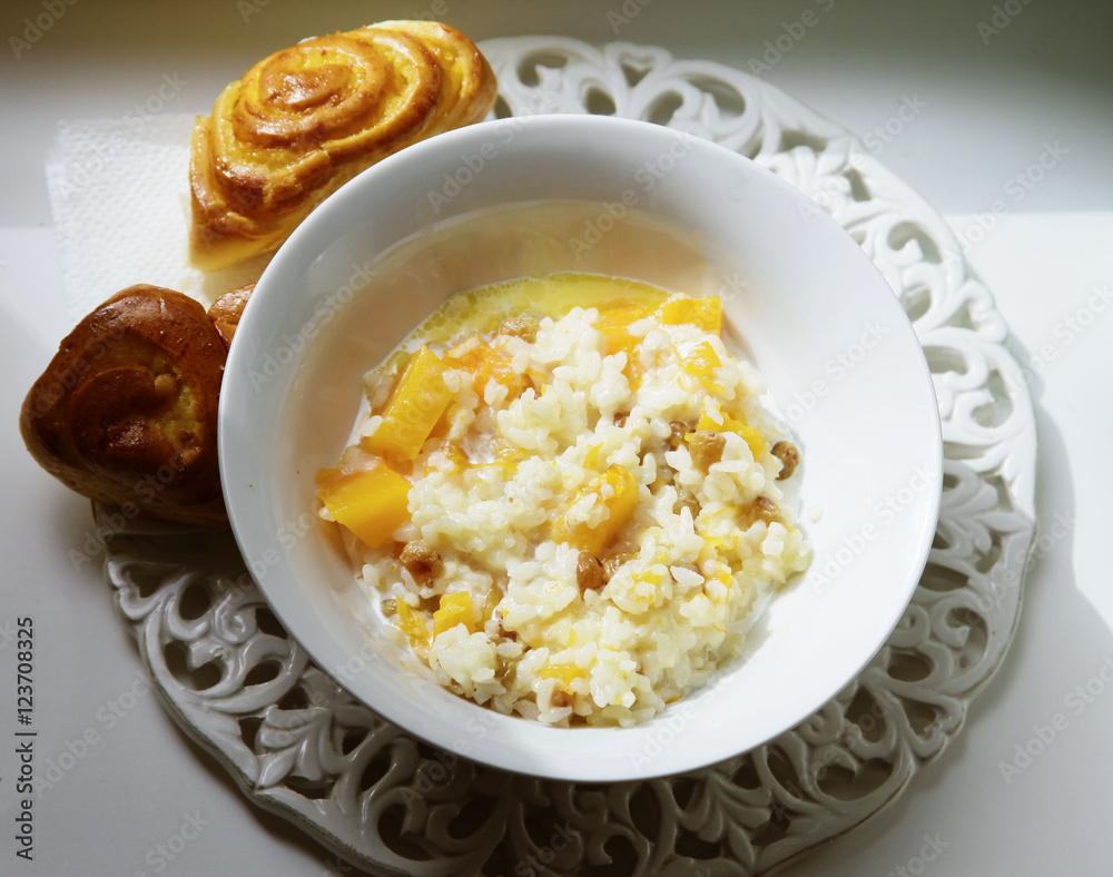Healthy homemade porridge with millet, rice, pumpkin in a jar for breakfast, selective focus Healthy homemade porridge with millet, rice, pumpkin in a jar for breakfast, selective focus