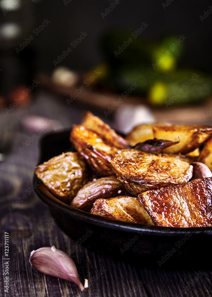 Baked potato wedges with garlic, christmas garnish Baked potato wedges with garlic, christmas garnish