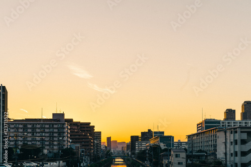 City at riverside at sunset